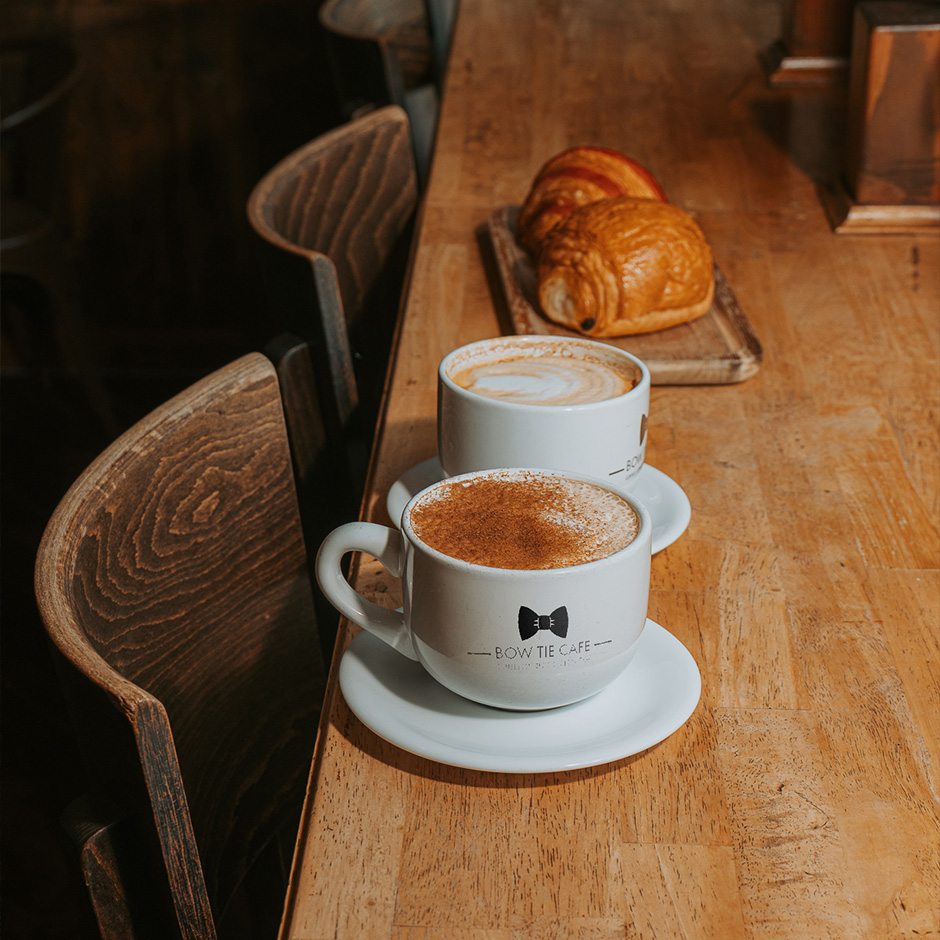 Bow Tie Cafe table with coffee and food